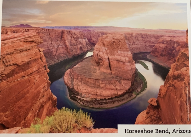 Aerial view of a meandering river in a canyon.
