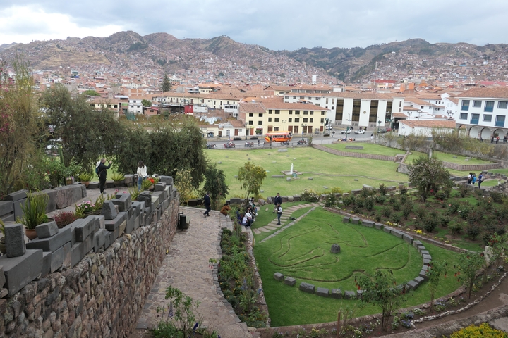 Overlooking cityscape from a landscaped garden.
