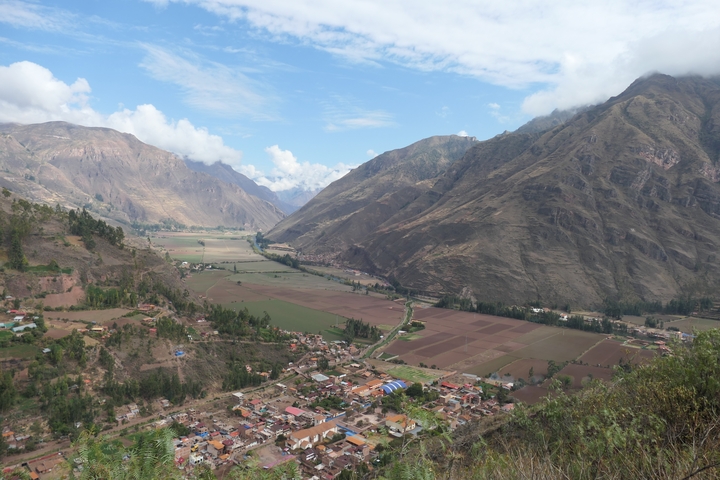       Valley view with mountains and small villages.
  