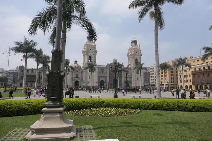 Large square with historical architecture and people.