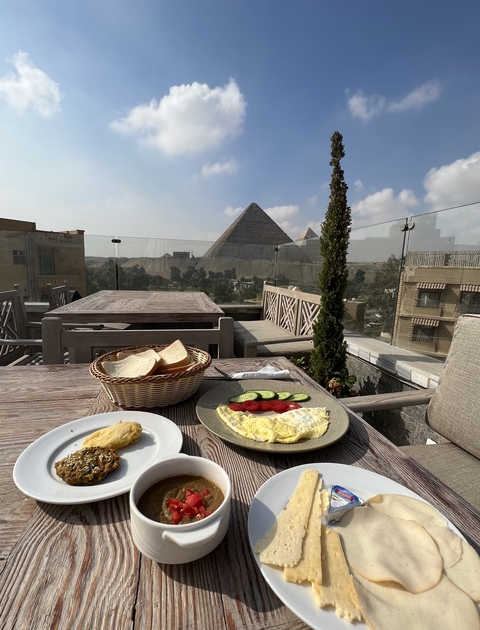       Breakfast with view of the pyramids in the background.
  