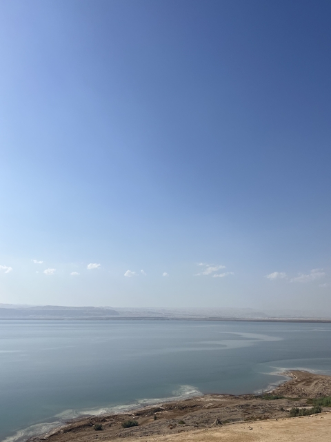 Clear blue sky with a distant horizon.