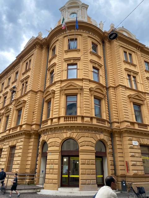Ornate classical building with columns and European architectural design.