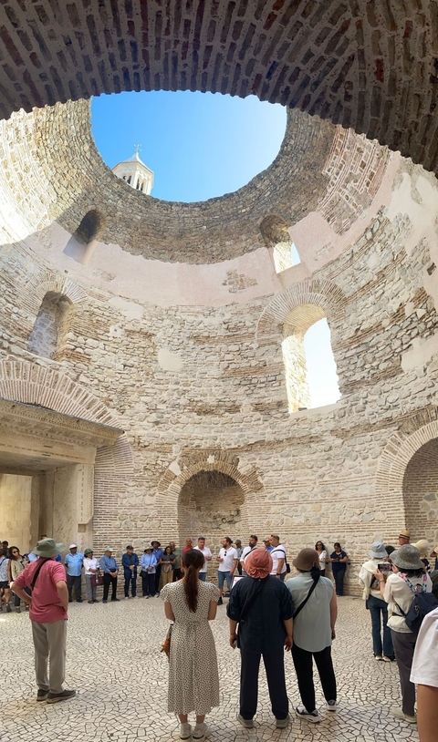 Interior of an ancient stone building with arches.