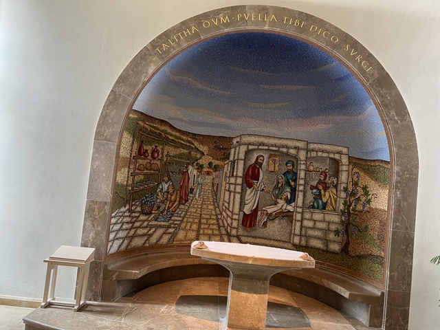 Colorful religious mosaic inside a chapel.