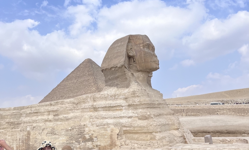       The iconic Sphinx in front of the Pyramids of Giza.
  