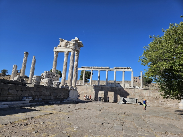       Tourists exploring a well-preserved ancient site.
  