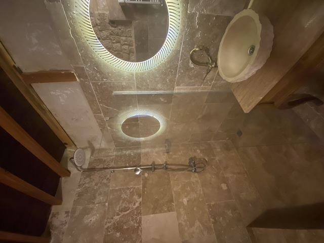 Bathroom with modern fixtures and lighting.