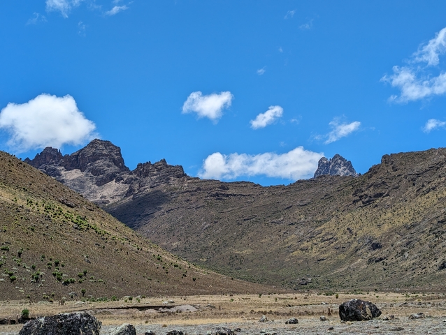       Mountain landscape with clear blue sky.
  