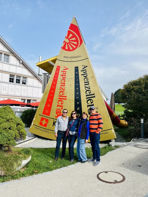       Group by a giant cheese sculpture.
  