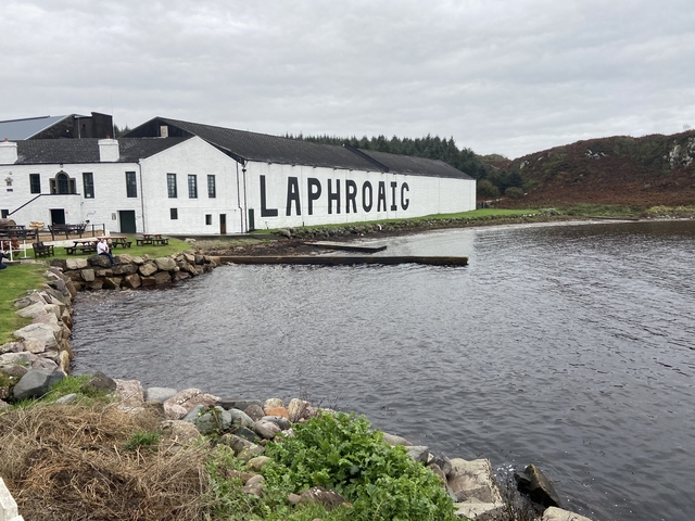 Laphroaig distillery by the water on a cloudy day.
