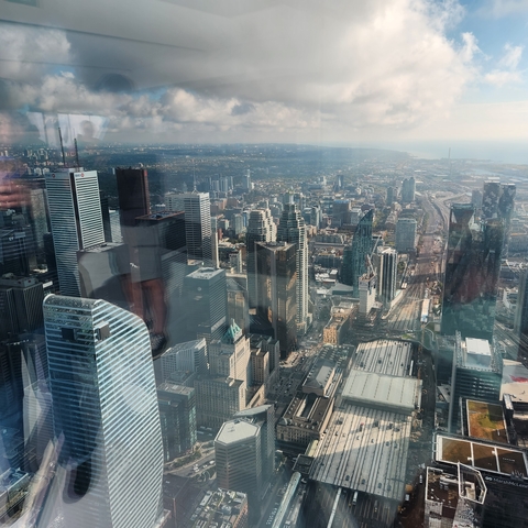 Aerial view of a bustling city with tall buildings.