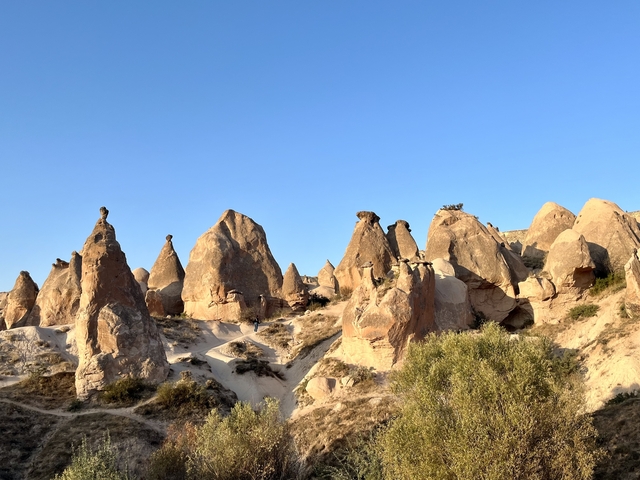       Fairy chimneys under a clear blue sky
  