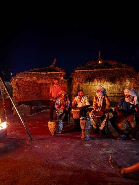 Musicians performing in a traditional setting.