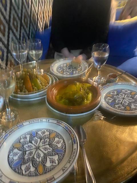       People dining with traditional dishes.
  