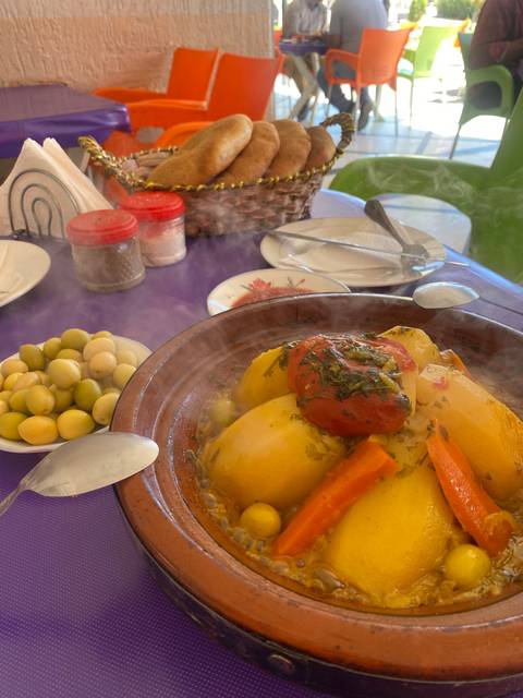 Traditional Moroccan tagine dish served with bread.