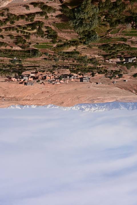       Desert landscape with mountain range in the background.
  
