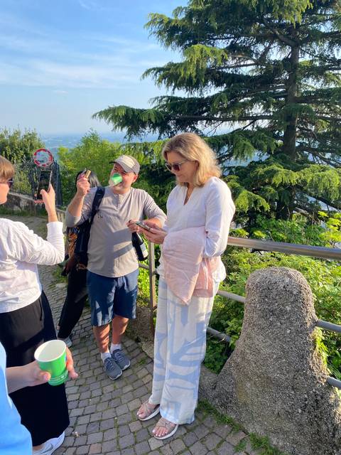 Group of people standing in a scenic area.