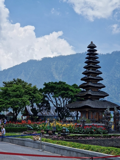 Pagoda with mountain and trees in the background.