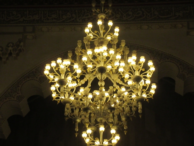       Bright chandelier in a decorated interior.
  
