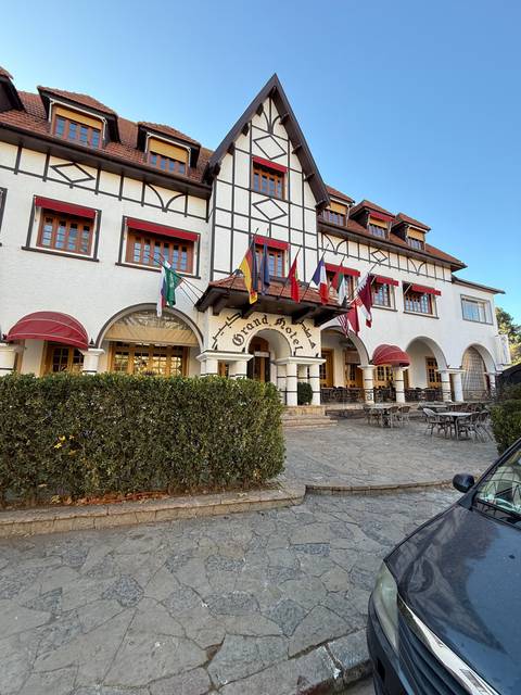 Upscale hotel exterior with Tudor-style architecture.