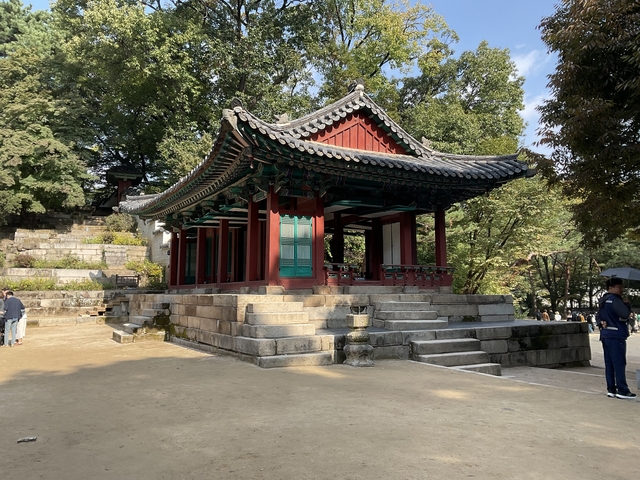       Traditional Korean pavilion with stone stairs.
  