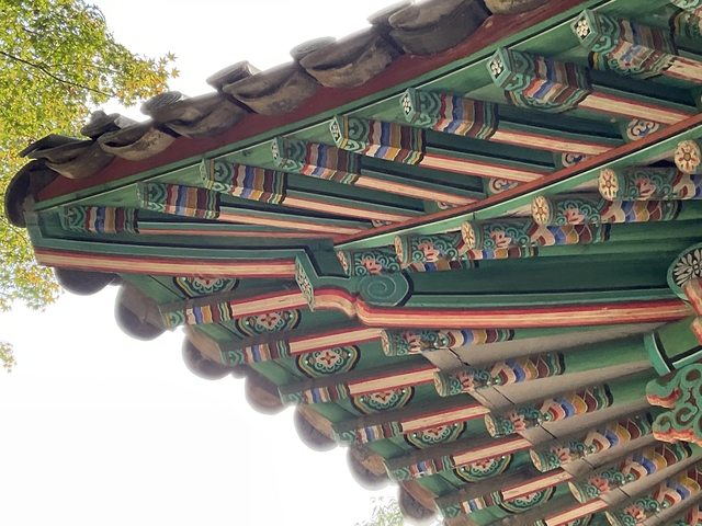       Close-up of colorful traditional roof architecture.
  