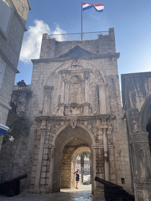       Ancient stone archway with ornate carvings.
  