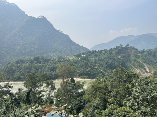 River with forested hills.