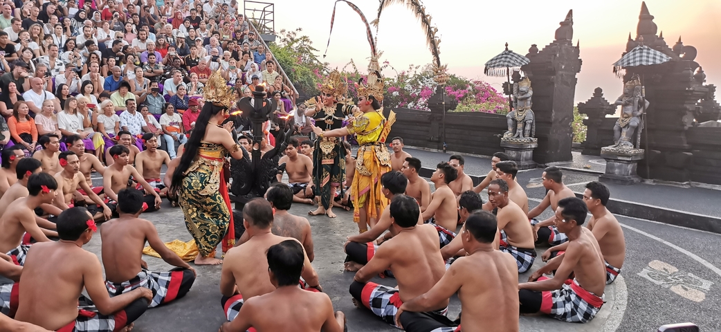 Traditional Balinese dance performance with an audience.