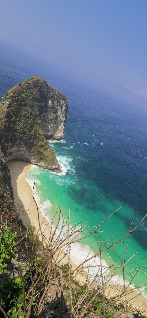 Stunning coastal landscape with clear waters and cliffs.