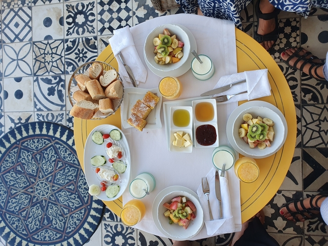 Table with assorted breakfast food items.