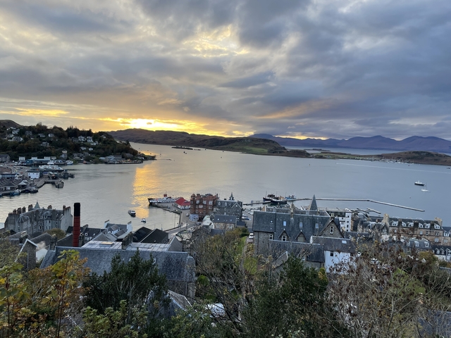       City view over a bay during sunset.
  