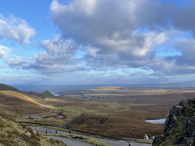       Expansive landscape with hills and clouds.
  