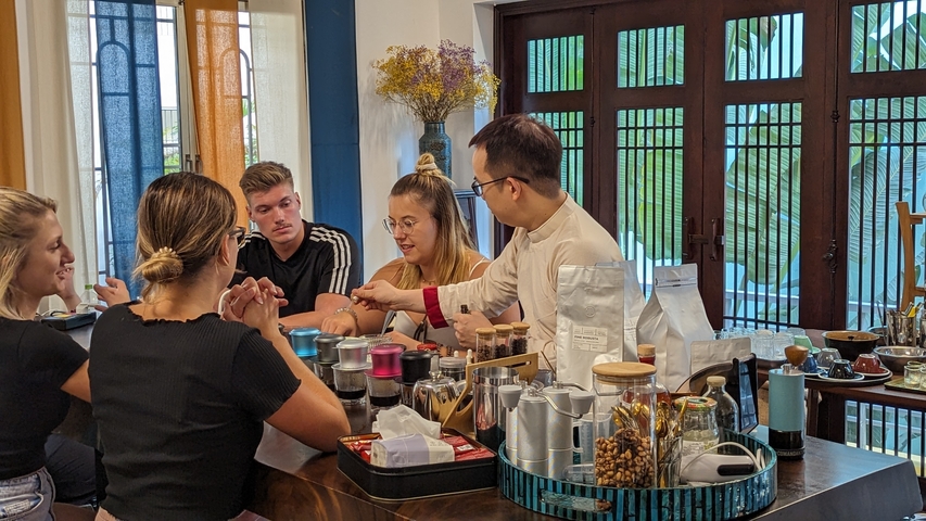 Group of people engaged in a guided coffee experience.