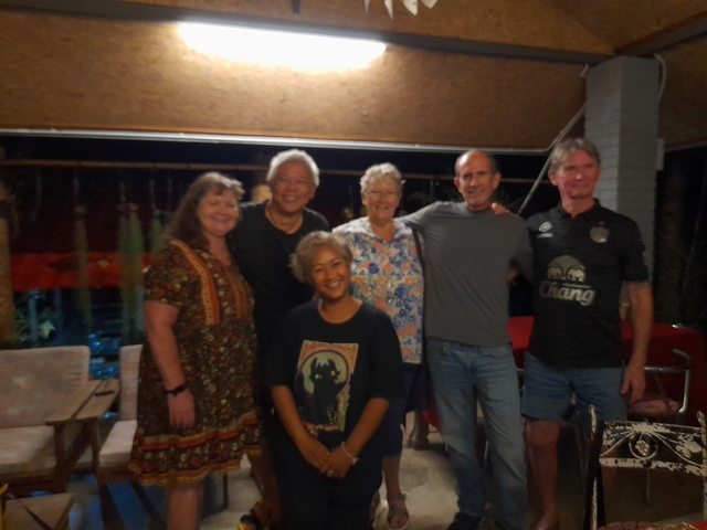 Indoor photo of a group of people, appears slightly blurry.