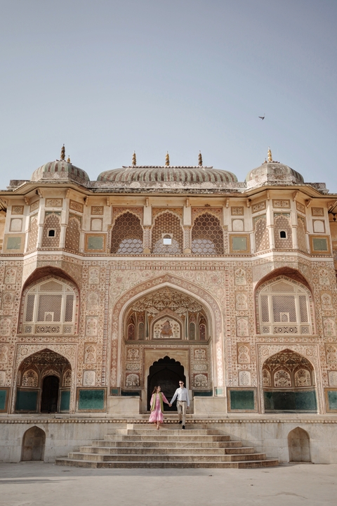 Ornate facade of an Indian palace with intricate designs.