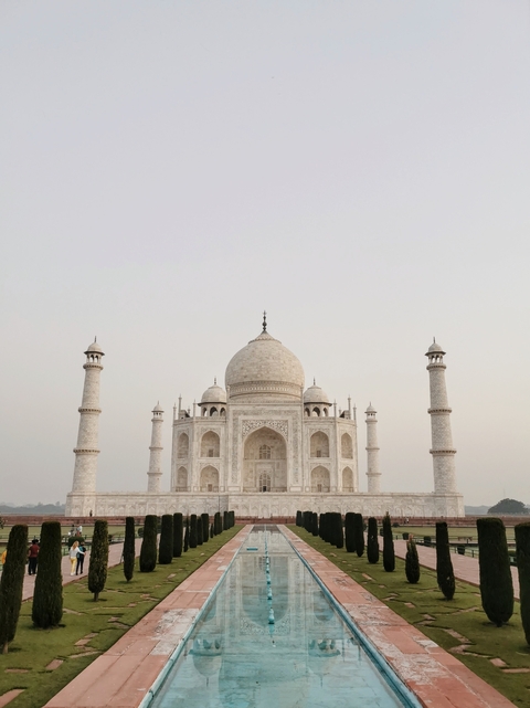 Front view of the Taj Mahal with its iconic dome and minarets.