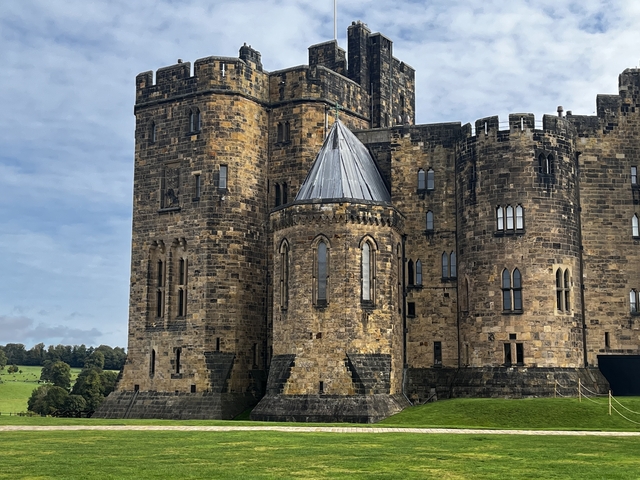 Large stone castle resembling Alnwick Castle.
