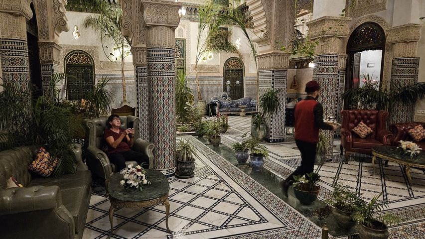      Elegant interior with traditional Moroccan tiles and furnishings.
  