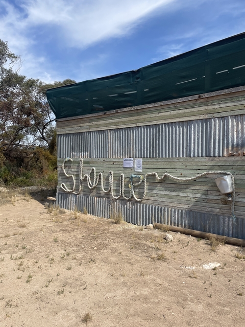       Rustic building with rope art spelling a word
  