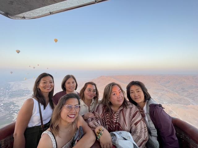 Group in a hot air balloon with a view