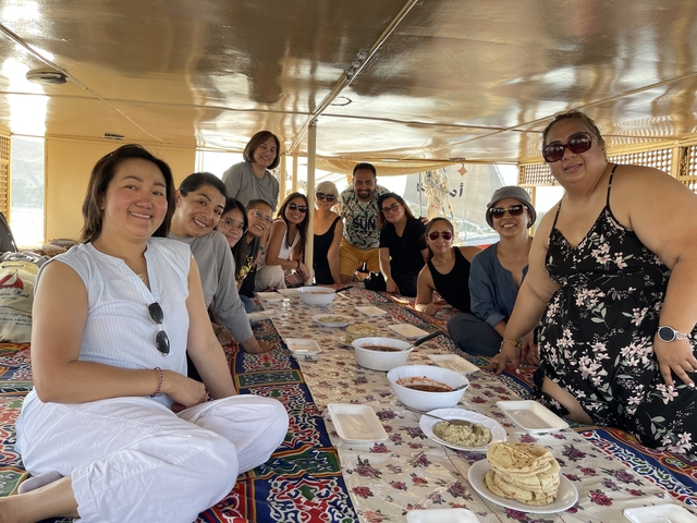       Group dining on a boat
  