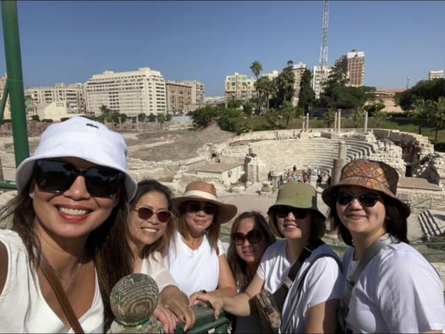 Group photo in front of Roman amphitheater ruins