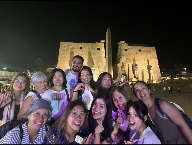 Group photo at night in front of Luxor Temple