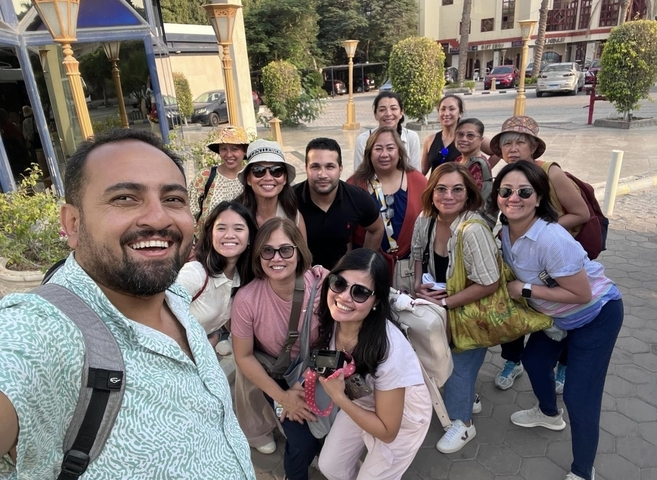       Group photo outdoors in the city
  