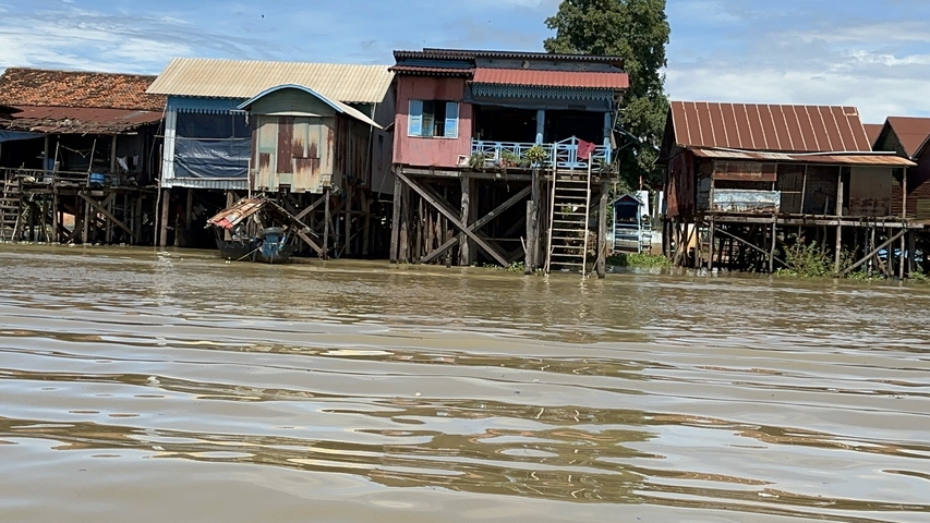       Houses on stilts over water.
  