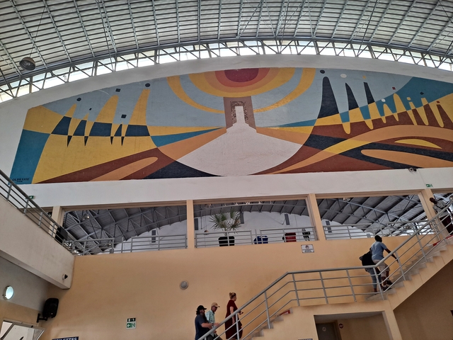       Mural painting in a large indoor space.
  