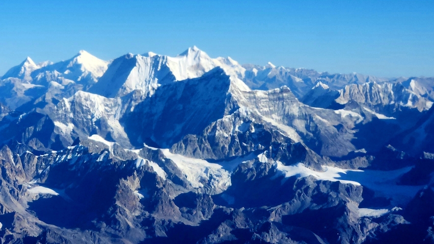       Snow-capped mountains with clear blue skies.
  