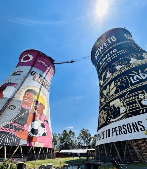 Two painted cooling towers in Soweto, Johannesburg.